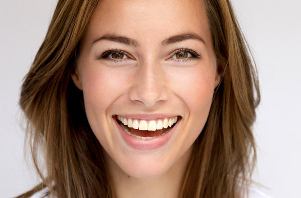 Beautiful woman smiling after cosmetic dental treatment in Concord, CA.